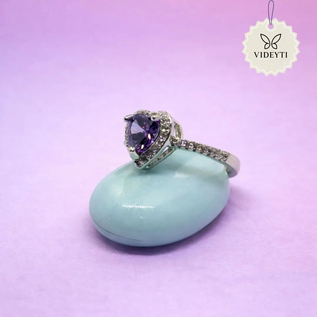Silver stainless steel ring with heart cut lavender crystal and pavé stones; adjustable Korean-style anti-tarnish jewelry.