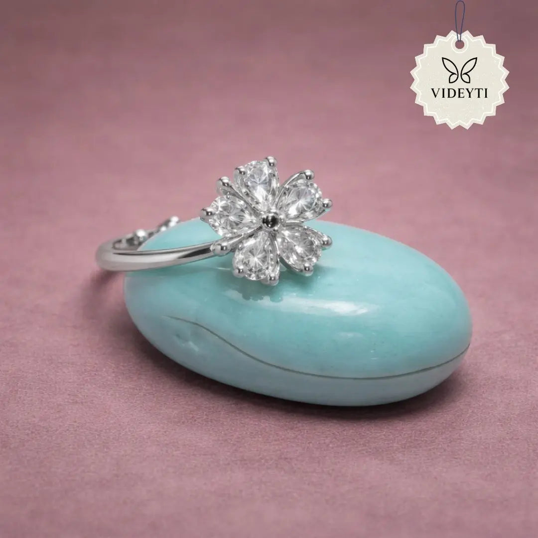 Silver stainless steel floral ring with five crystal petals; adjustable Korean-style anti-tarnish jewelry.