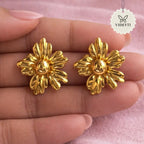 Golden floral stud earrings with sculpted petal design