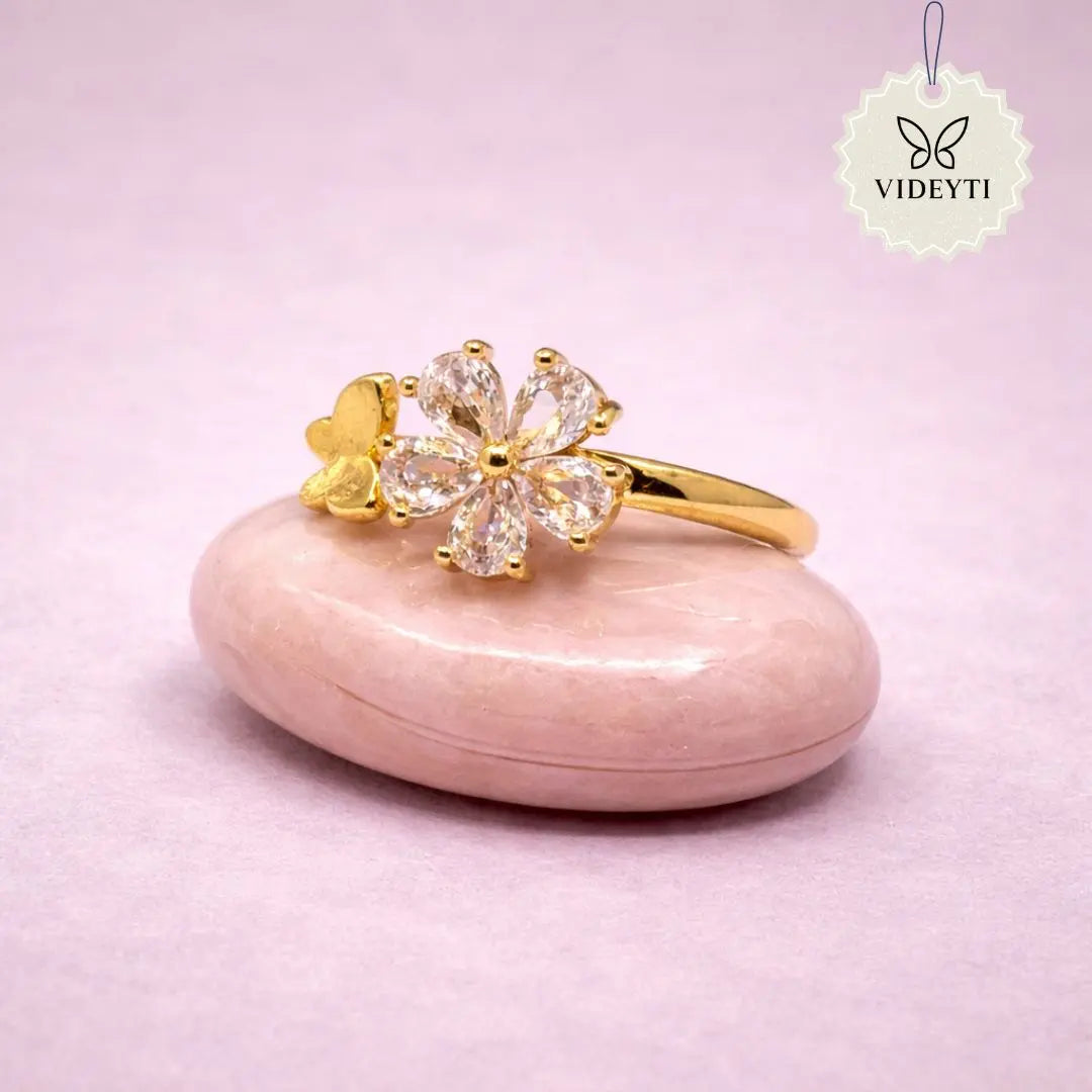 Gold floral ring with crystal petals; adjustable stainless steel anti-tarnish Korean-style jewelry.