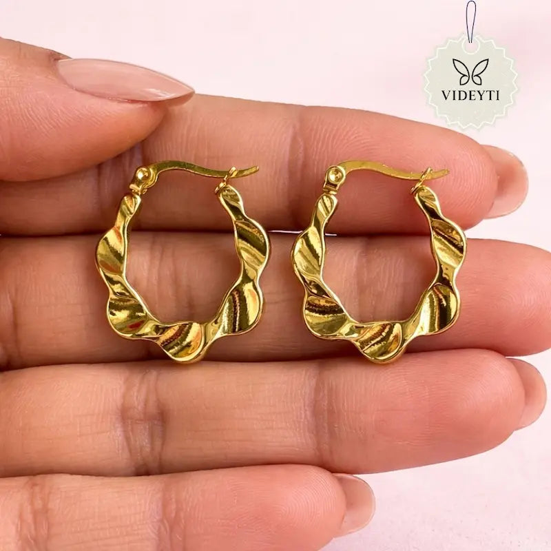 Twisted wave hoop earrings with gold-tone finish