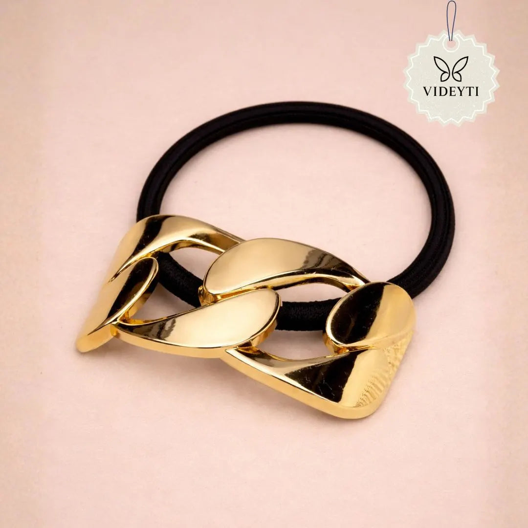 Black elastic hair tie with gold chain accent