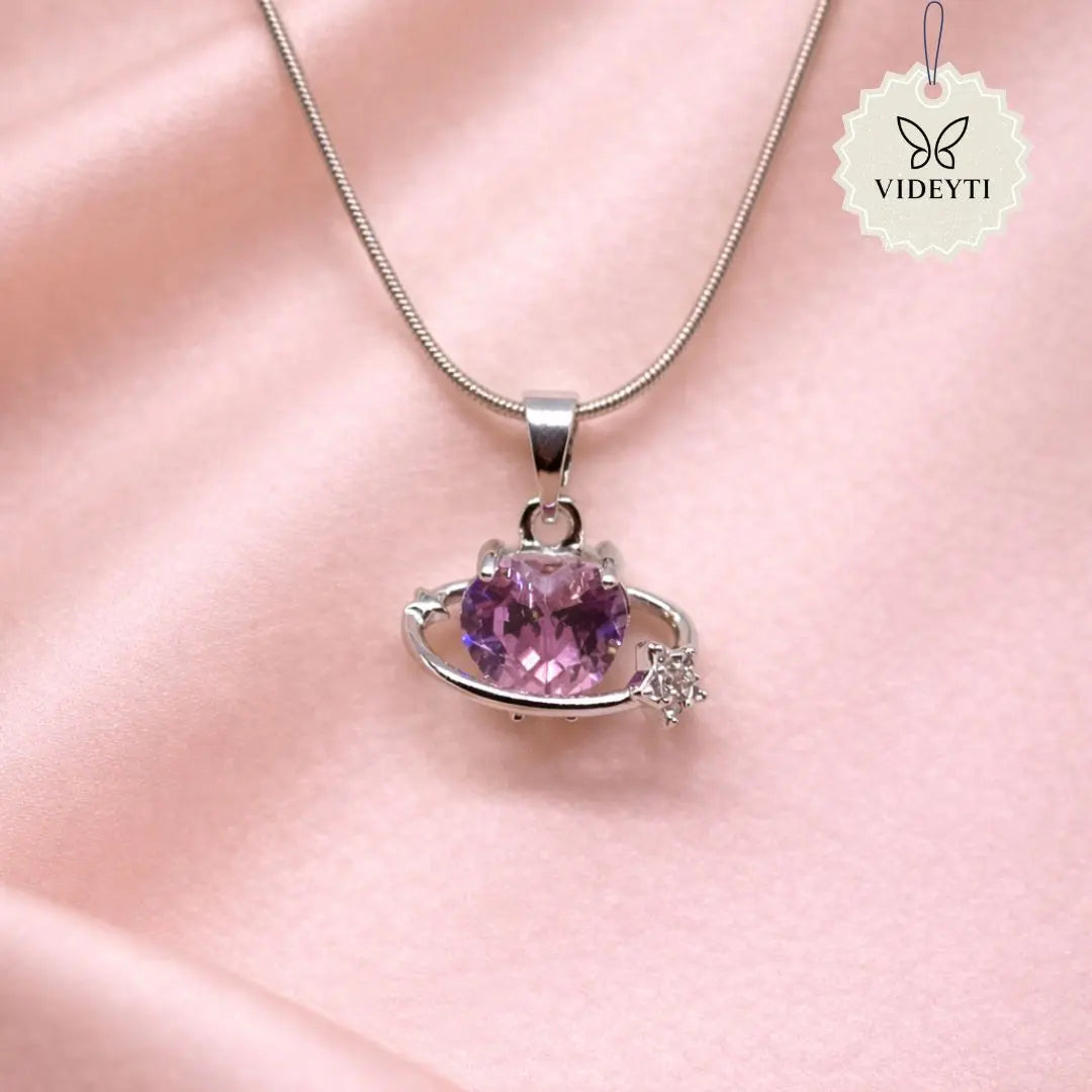 Silver planet pendant necklace with pink crystal