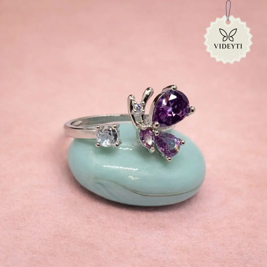 Silver stainless steel butterfly ring with lavender crystal wings; adjustable anti-tarnish Korean-style jewelry.