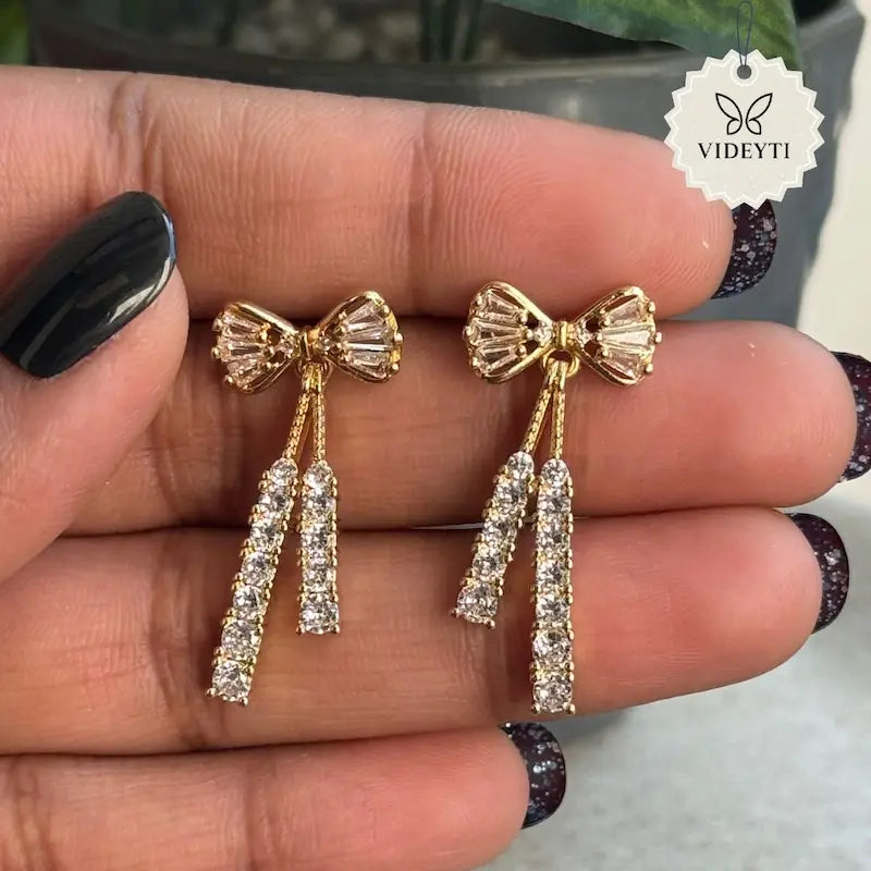 Gold-tone crystal bow drop earrings