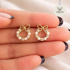 Gold-tone pearl crystal bow stud earrings