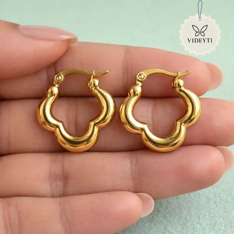Scalloped hoop earrings with polished gold-tone finish