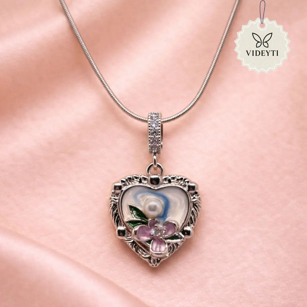 Silver heart pendant necklace with floral enamel and crystals