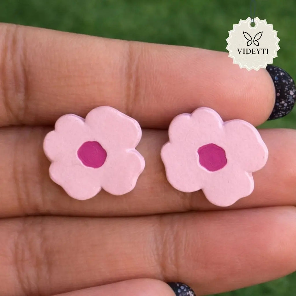 Gold-tone pink enamel flower stud earrings