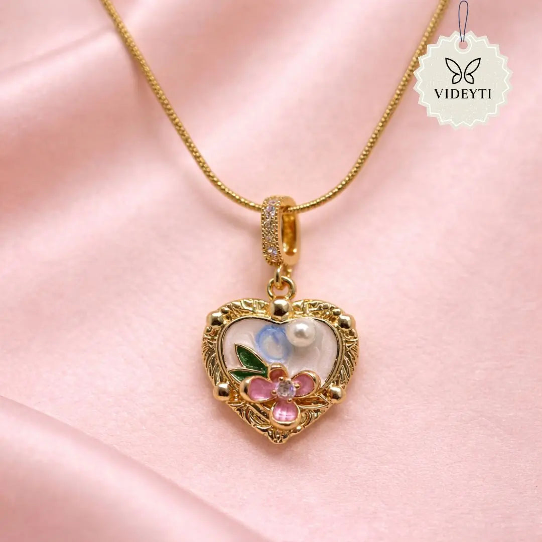 Gold heart pendant necklace with floral enamel and pearl detail