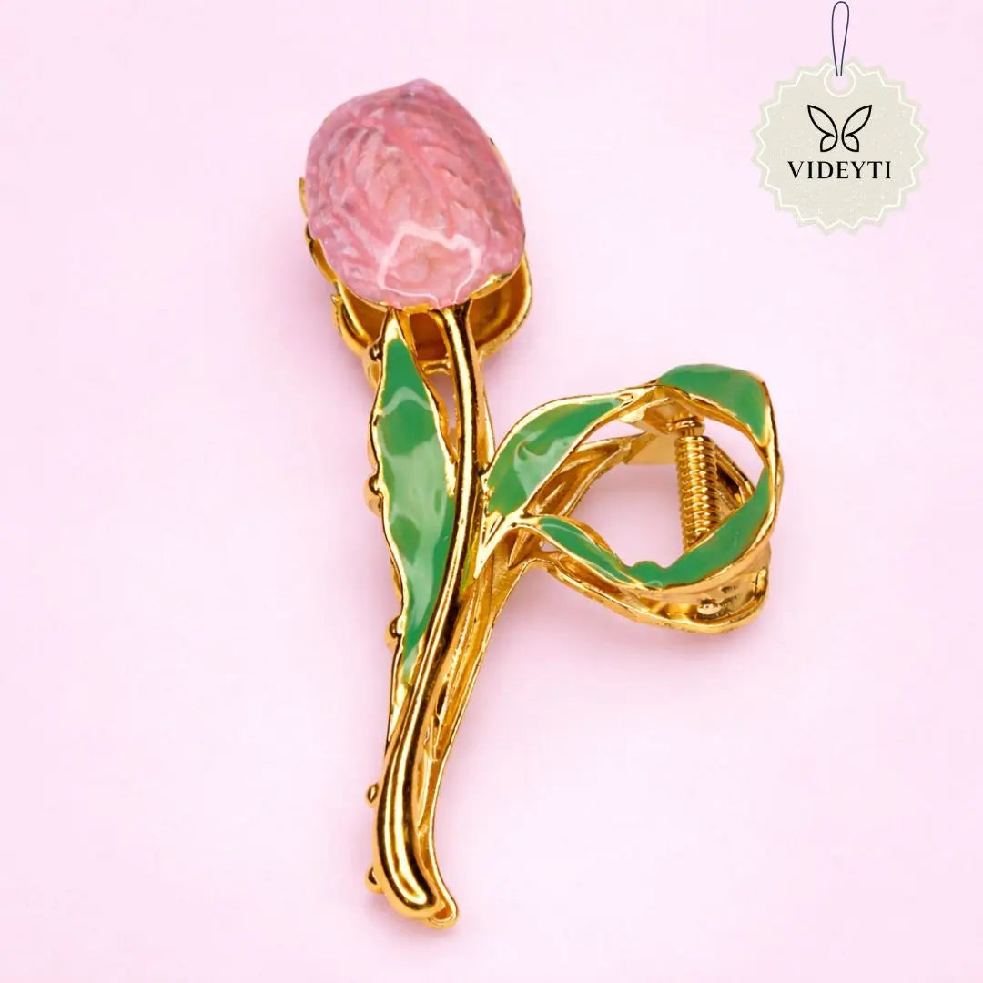 Gold metal hair clip with pink tulip and green leaves