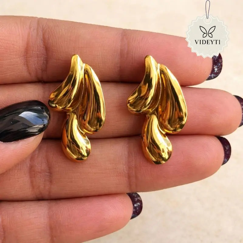 Gold-tone sculpted wave stud earrings