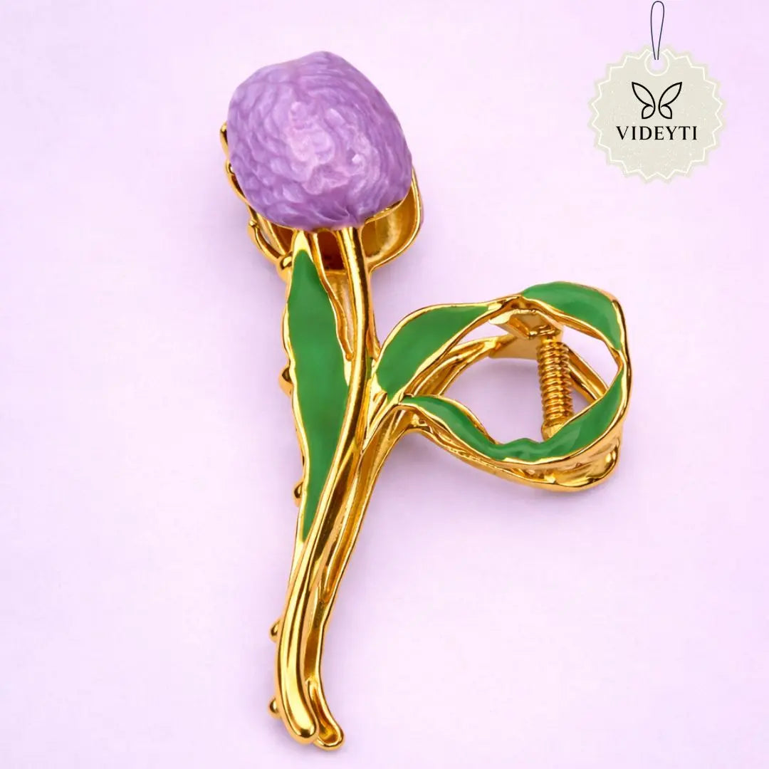 Gold metal hair clip with purple tulip and green leaves