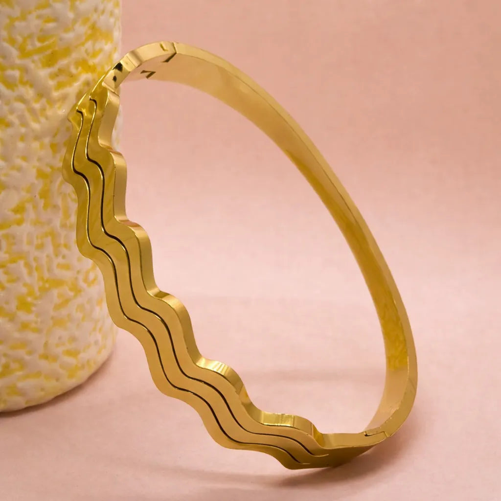 Golden wave design bangle bracelet for women